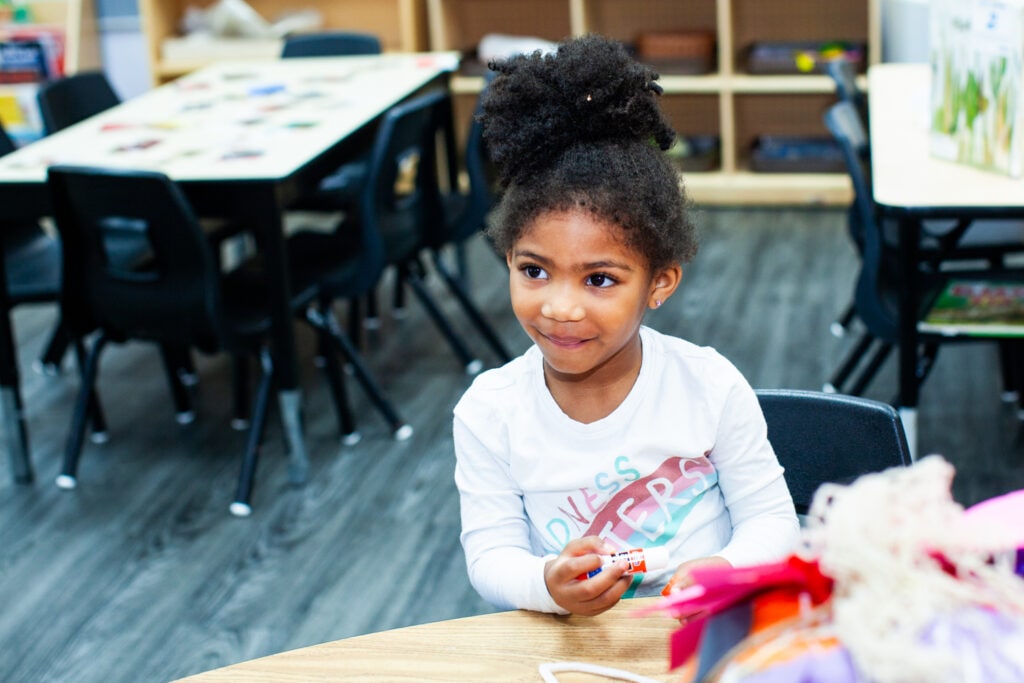 Girl with glue and crafts