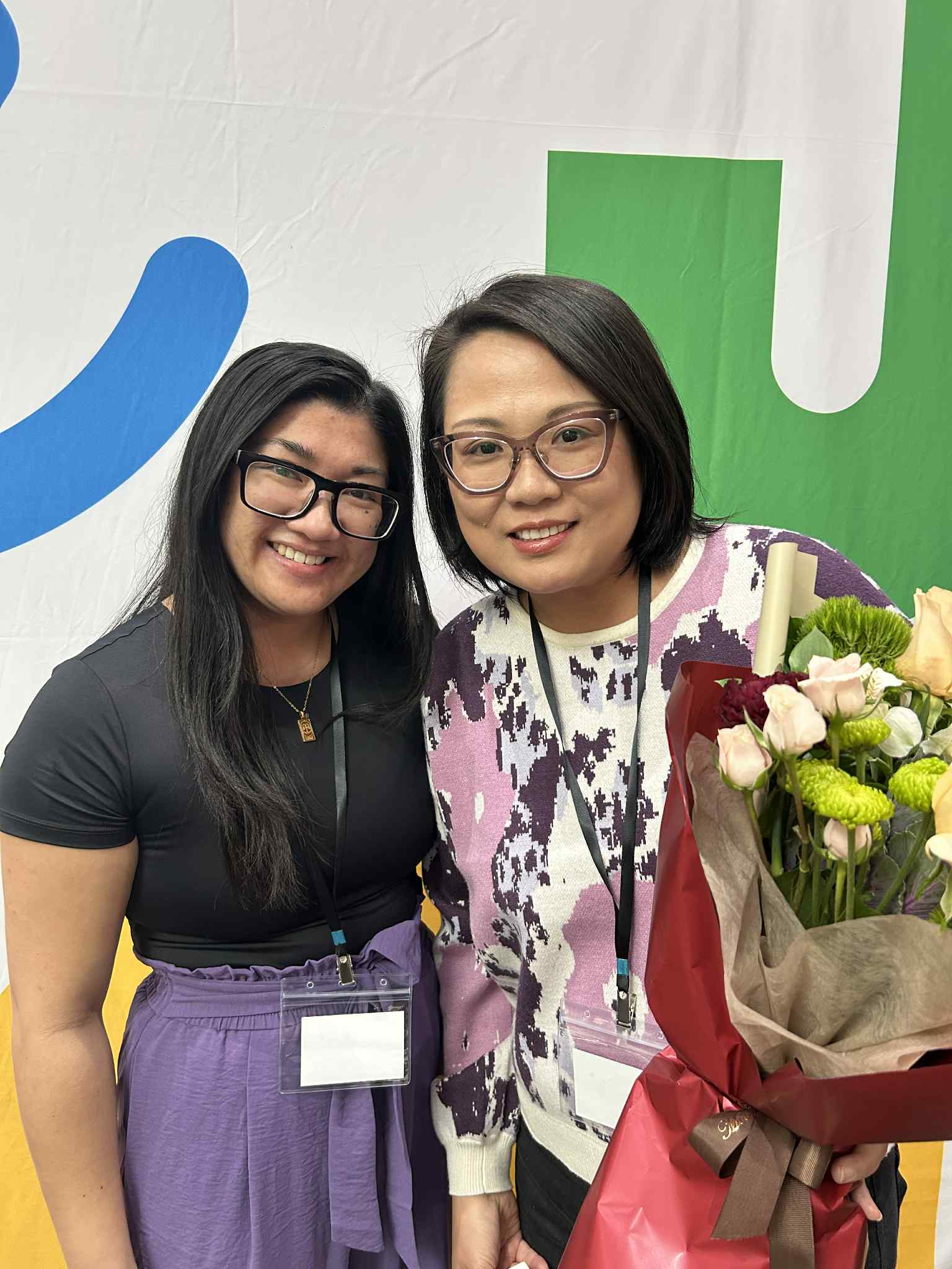 Two women smiling at the camera