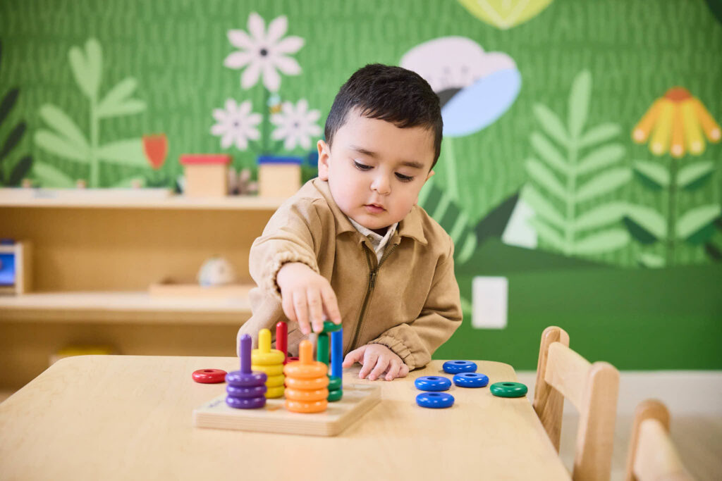 Toddler playing on a table